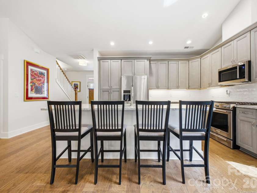 2 Lifestyle Court, Arden, NC 28704.  MLS# CAR4360396, YatesRealty ID 13985. Kitchen island with seating