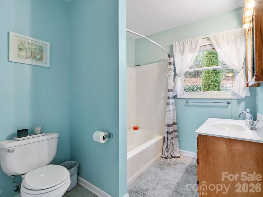 26 Morrow Drive, Fairview, NC 28730.  MLS# CAR4349703, YatesRealty ID 13987. En-suite bathroom in the main-level primary