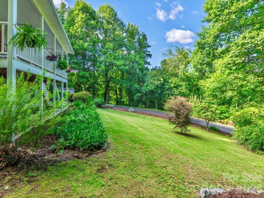 26 Morrow Drive, Fairview, NC 28730.  MLS# CAR4349703, YatesRealty ID 13987. Great, sunny yard