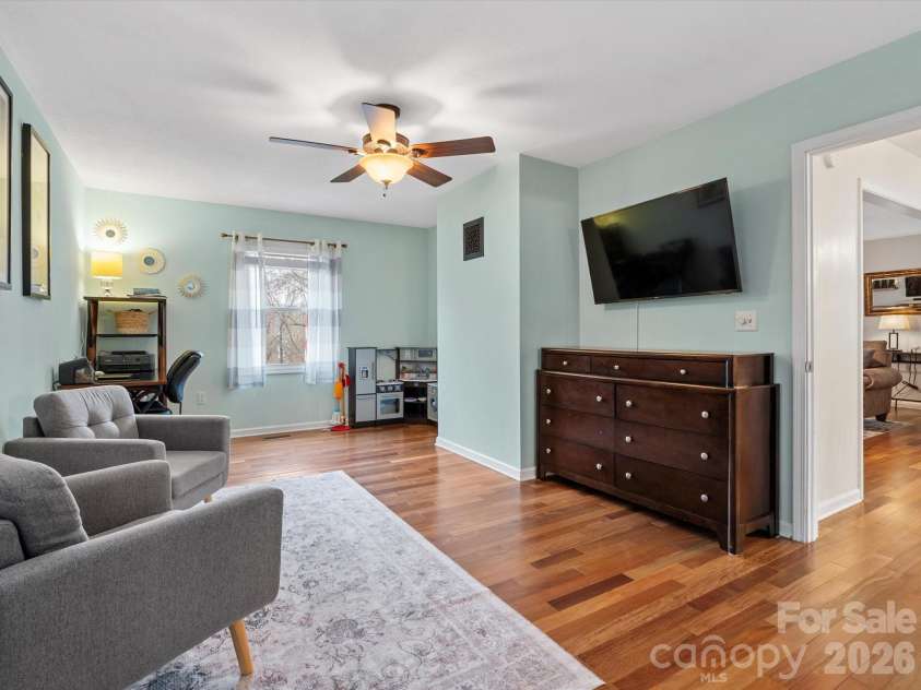 26 Morrow Drive, Fairview, NC 28730.  MLS# CAR4349703, YatesRealty ID 13987. Main-level primary bedroom