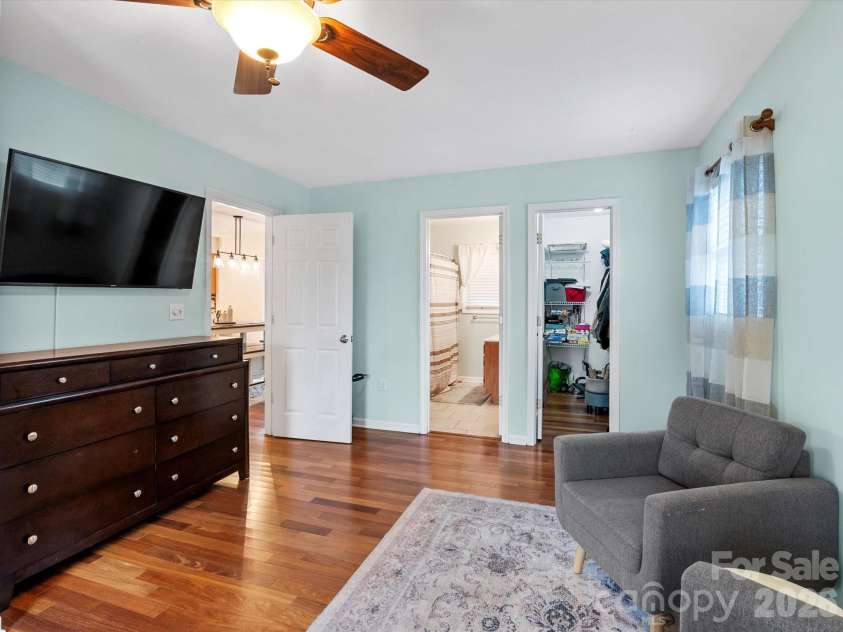 26 Morrow Drive, Fairview, NC 28730.  MLS# CAR4349703, YatesRealty ID 13987. Main-level primary bedroom with walk-in closet