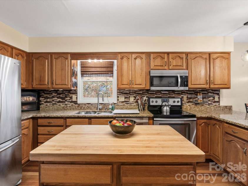 26 Morrow Drive, Fairview, NC 28730.  MLS# CAR4349703, YatesRealty ID 13987. Spacious kitchen and island