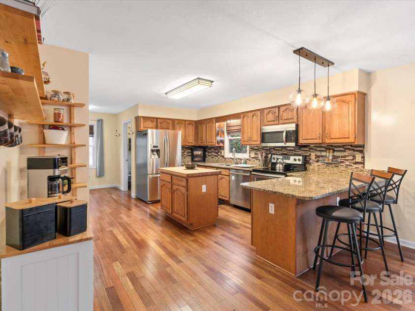 26 Morrow Drive, Fairview, NC 28730.  MLS# CAR4349703, YatesRealty ID 13987. View into the kitchen