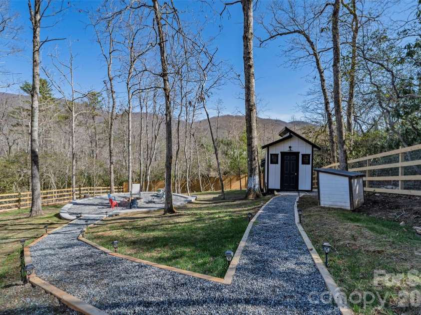 26 Pineview Road, Fairview, NC 28730.  MLS# CAR4357882, YatesRealty ID 13989. Chicken coop and fire pit
