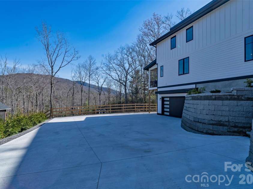 26 Pineview Road, Fairview, NC 28730.  MLS# CAR4357882, YatesRealty ID 13989. Garage entrance driveway