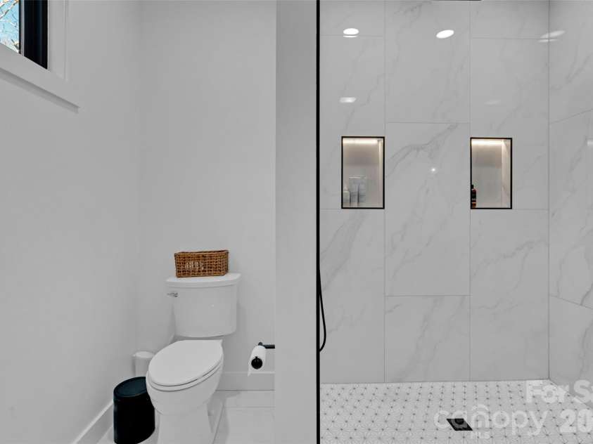 26 Pineview Road, Fairview, NC 28730.  MLS# CAR4357882, YatesRealty ID 13989. Master shower/toilet