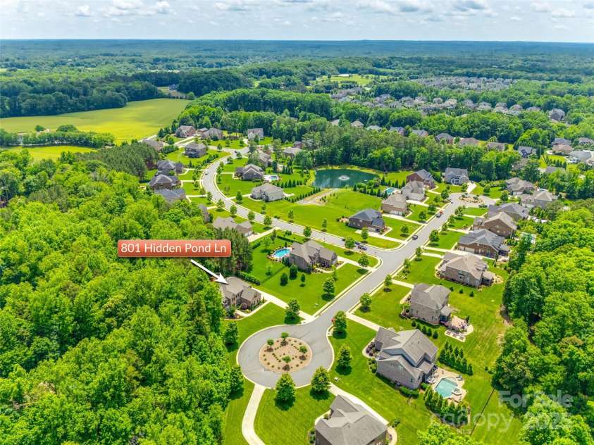 801 Hidden Pond Lane, Waxhaw, NC 28173.  MLS# CAR4253726, YatesRealty ID 13993. Sought after neighborhood and location.  This boutique neighborhood is an enclave of large homesites with a serene pond and fountain.