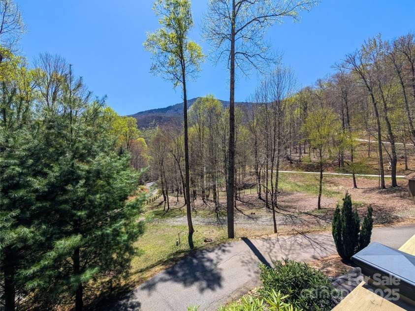 13 Miners Trace Road, Burnsville, NC 28714.  MLS# CAR4206928, YatesRealty ID 13994. Enjoy the awesome mountain views from front deck!