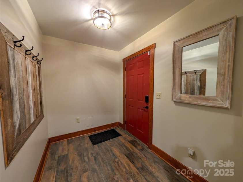13 Miners Trace Road, Burnsville, NC 28714.  MLS# CAR4206928, YatesRealty ID 13994. Entry area for finished basement