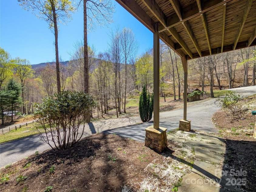 13 Miners Trace Road, Burnsville, NC 28714.  MLS# CAR4206928, YatesRealty ID 13994. Mountain view from underneath deck and parking.