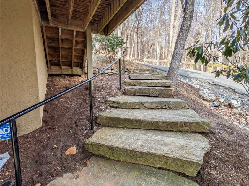 13 Miners Trace Road, Burnsville, NC 28714.  MLS# CAR4206928, YatesRealty ID 13994. Walkway to fully finished basement that is accessed from separate entrance below