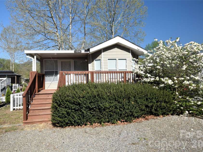 124 Pike Point, Waynesville, NC 28785.  MLS# CAR4371521, YatesRealty ID 13996. From the road, note the 3 car spaces in front