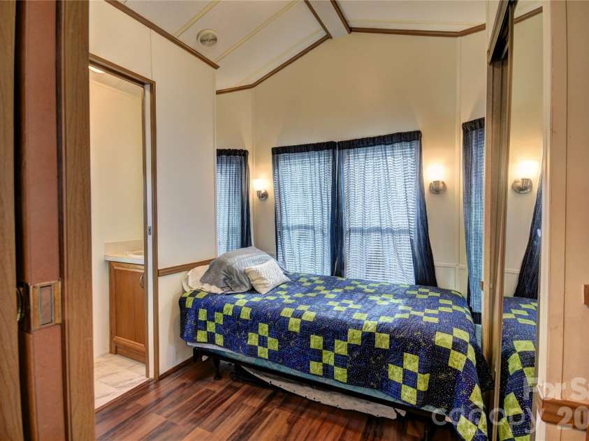 124 Pike Point, Waynesville, NC 28785.  MLS# CAR4371521, YatesRealty ID 13996. Front Bedroom with a half-bath