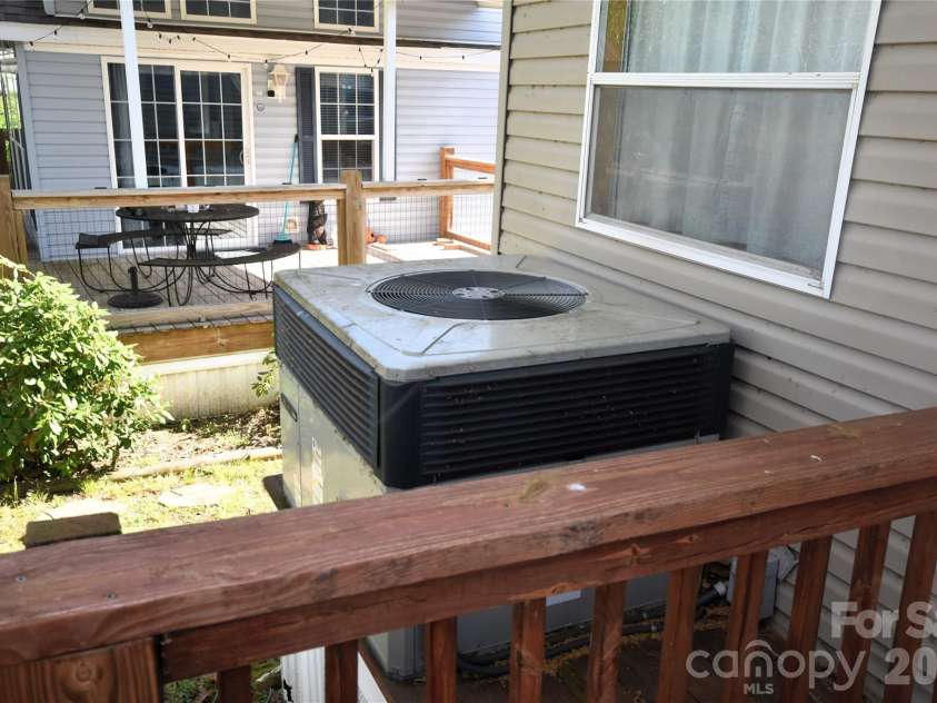124 Pike Point, Waynesville, NC 28785.  MLS# CAR4371521, YatesRealty ID 13996. Heat pump unit off the rear deck