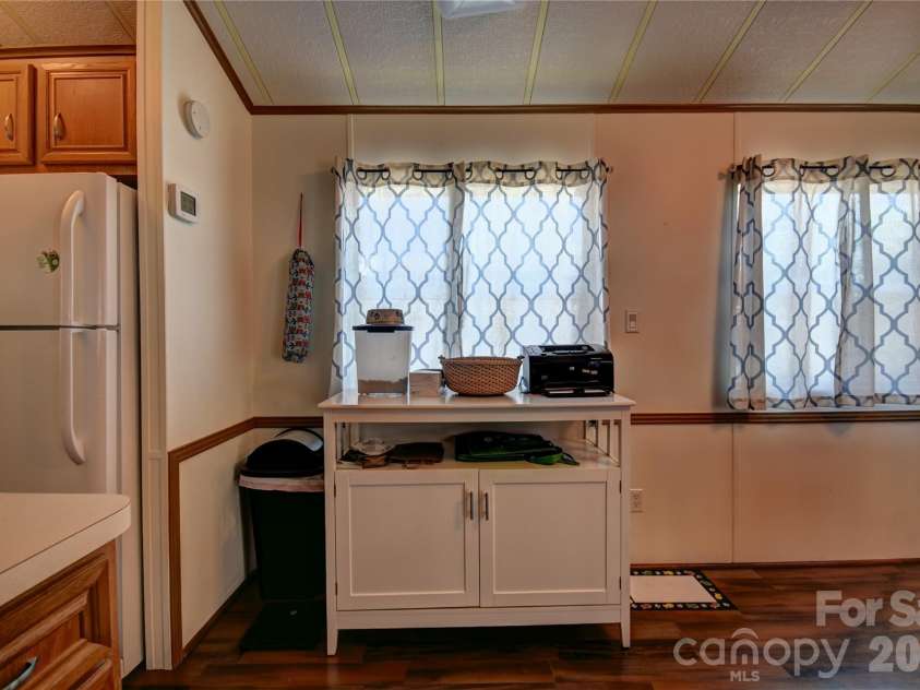 124 Pike Point, Waynesville, NC 28785.  MLS# CAR4371521, YatesRealty ID 13996. Opposite wall from the kitchen cabinets