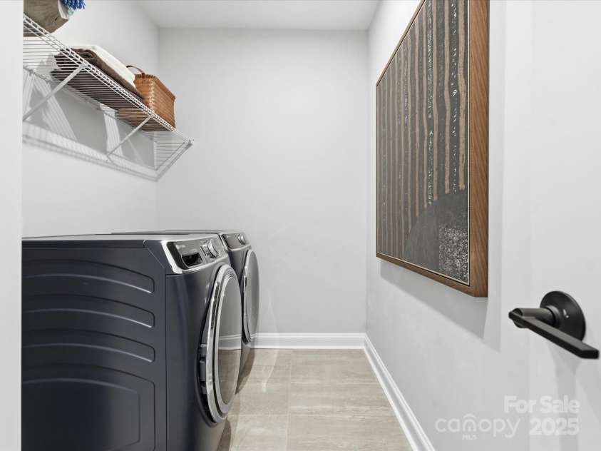 5115 Hoptree Street, Charlotte, NC 28277.  MLS# CAR4318199, YatesRealty ID 13998. Laundry Room with Modern Tile Design. *Model Photos | Actual Finishes, Structural Selections, and Orientation May Vary.