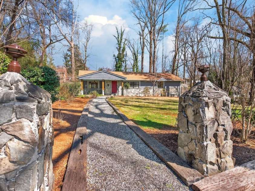 95 Whitney Avenue, Tryon, NC 28782.  MLS# CAR4354640, YatesRealty ID 14002. Stone columns