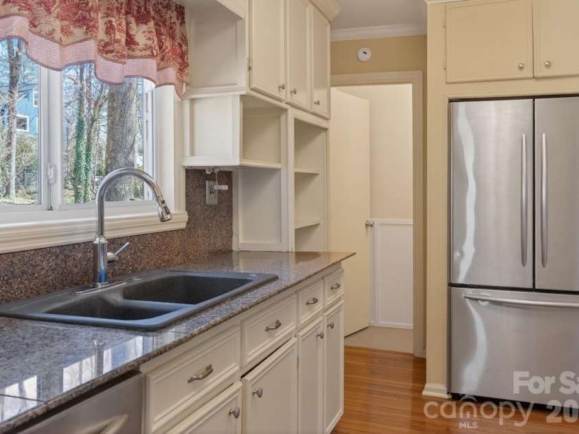 95 Whitney Avenue, Tryon, NC 28782.  MLS# CAR4354640, YatesRealty ID 14002. Window over the kitchen sink