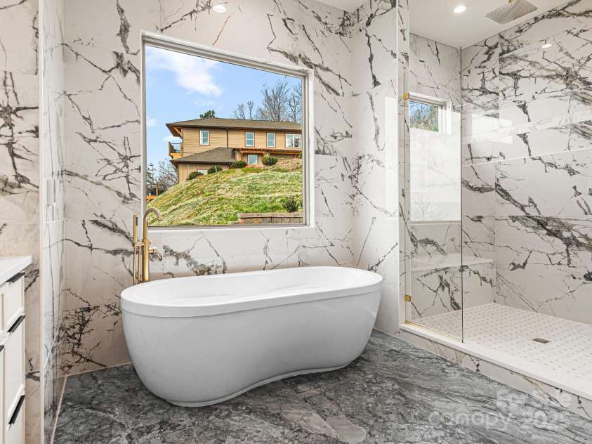 246 Half Moon Mile None, Lake Lure, NC 28746.  MLS# CAR4221091, YatesRealty ID 14004. Primary bath with custom shower