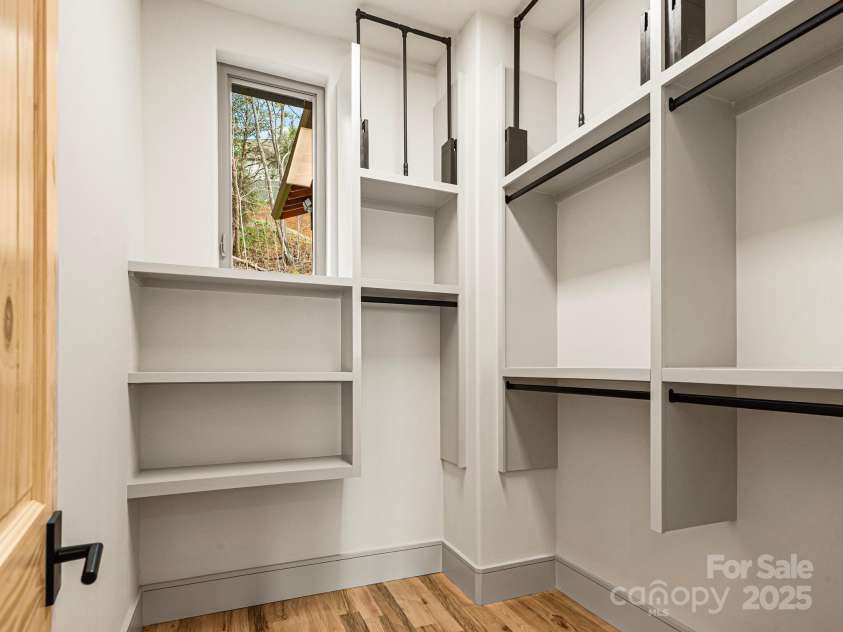 246 Half Moon Mile None, Lake Lure, NC 28746.  MLS# CAR4221091, YatesRealty ID 14004. Primary Suite closet with easy access pull down system