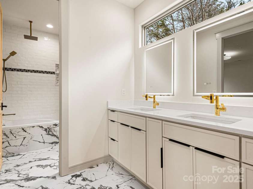 246 Half Moon Mile None, Lake Lure, NC 28746.  MLS# CAR4221091, YatesRealty ID 14004. Upper-level double vanity tub and rain head shower