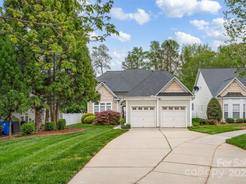 141 Ivy Creek Lane, Mooresville, NC 28115.  MLS# CAR4246190, YatesRealty ID 14012. Another view of the front with vinyl shake siding and two car garage