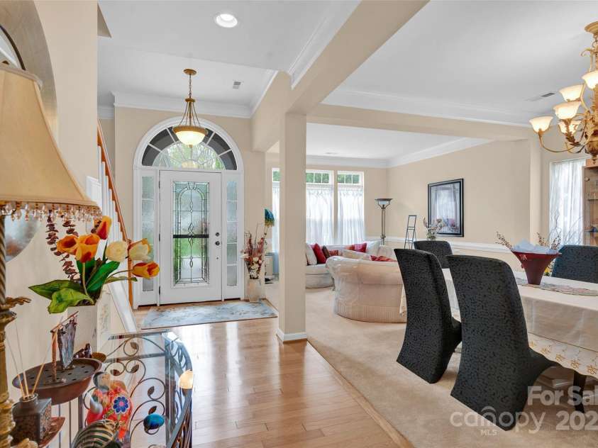 141 Ivy Creek Lane, Mooresville, NC 28115.  MLS# CAR4246190, YatesRealty ID 14012. Bright sunny entryway open to the living room and Dining room
