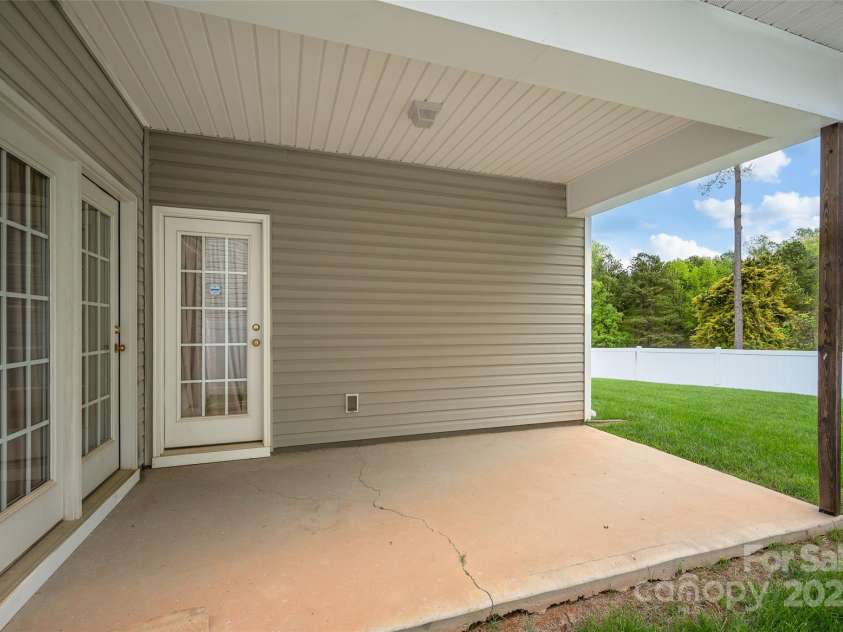 141 Ivy Creek Lane, Mooresville, NC 28115.  MLS# CAR4246190, YatesRealty ID 14012. Covered back patio for shade and relaxation