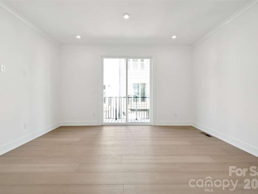 3656 Tryon Street, Charlotte, NC 28217.  MLS# CAR4362769, YatesRealty ID 14014. Great Room and balcony