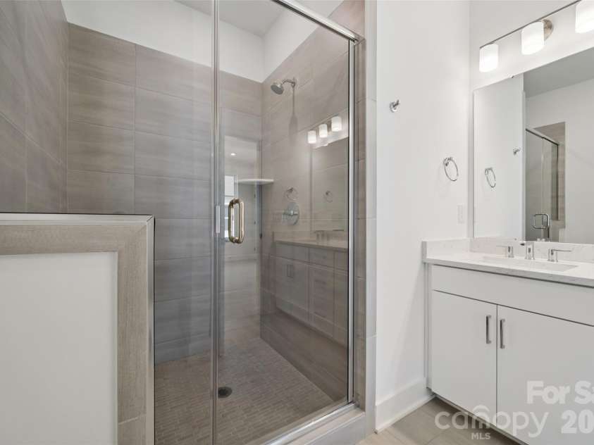 3656 Tryon Street, Charlotte, NC 28217.  MLS# CAR4362769, YatesRealty ID 14014. Tile Surrounded Shower with Bench