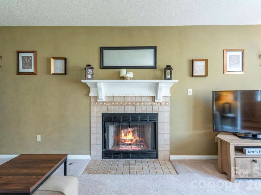 46 Foxberry Drive, Arden, NC 28704.  MLS# CAR4341597, YatesRealty ID 14016. Natural gas fireplace—perfect for cozy ambiance and extra warmth during power outages. Super convenient and never used by the current owners.