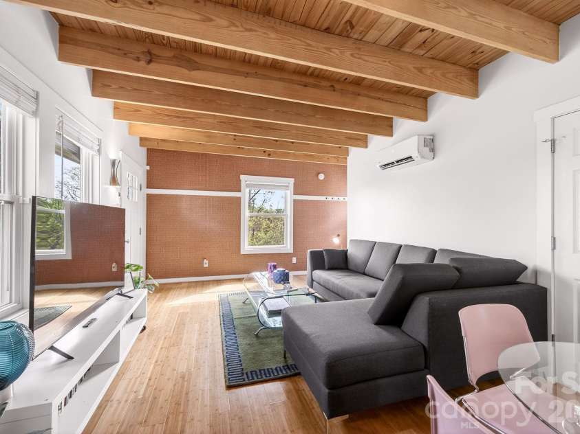 47 Mulberry Street, Asheville, NC 28804.  MLS# CAR4357444, YatesRealty ID 14018. Stunning pine ceiling and entry accent wall