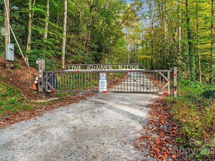 206 Willow Lane, Rosman, NC 28772.  MLS# CAR4290830, YatesRealty ID 1402. Gated entrance to community