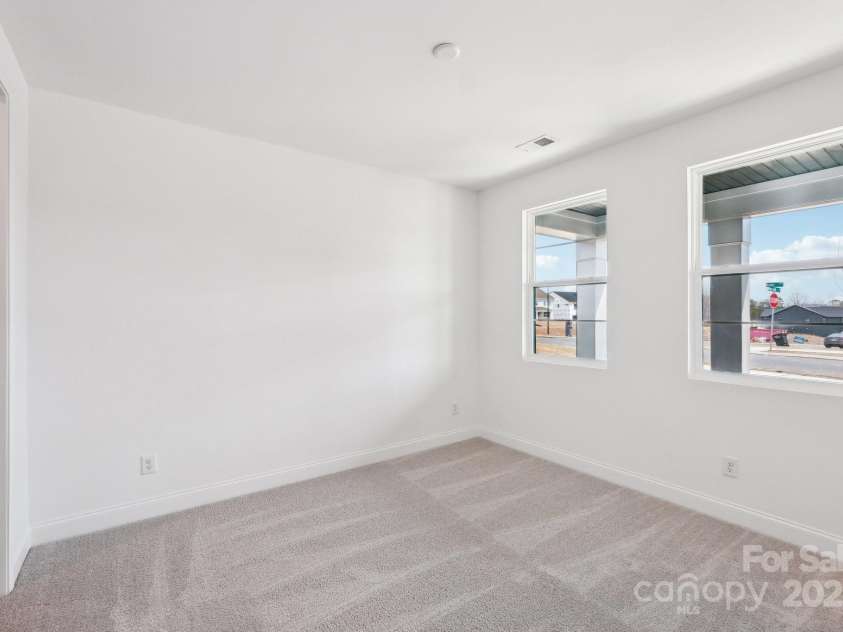 604 Hyder Trail, Tega Cay, SC 29708.  MLS# CAR4214719, YatesRealty ID 1402. Guest bedroom on main