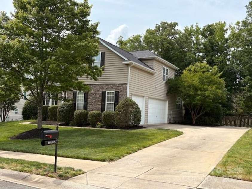 10008 King George Lane, Waxhaw, NC 28173.  MLS# CAR4257017, YatesRealty ID 14025. The 3-car side-load garage has room for three cars and all the stuff you swear you’ll use someday—because who doesn't need five extra hoses and that mystery box from 2008?