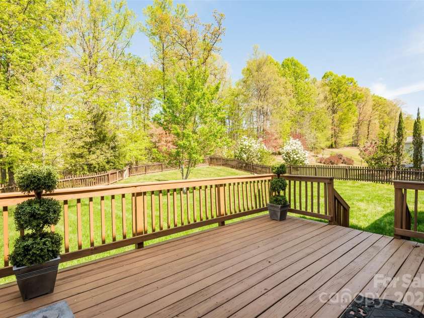 10008 King George Lane, Waxhaw, NC 28173.  MLS# CAR4257017, YatesRealty ID 14025. The backyard deck is the perfect retreat to relax and unwind, whether you're savoring a cocktail or cold beer as the sun sets, or peacefully sipping a hot cup of coffee at sunrise, surrounded by the soothing sounds of 