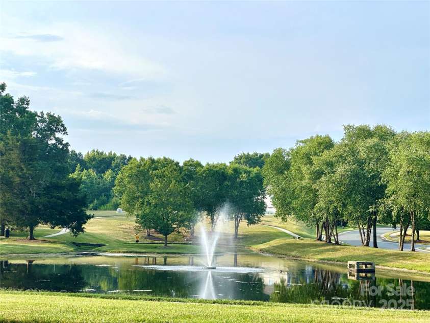10008 King George Lane, Waxhaw, NC 28173.  MLS# CAR4257017, YatesRealty ID 14025. The serene fishing pond, featuring a beautiful fountain, provides the perfect setting to relax, connect, and enjoy great conversations, or simply unwind with hours of peaceful fun.