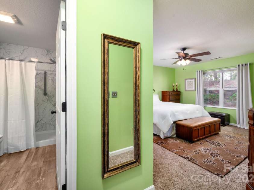 206 Carrington Place, Arden, NC 28704.  MLS# CAR4249528, YatesRealty ID 14027. Bedroom with ensuite and shower