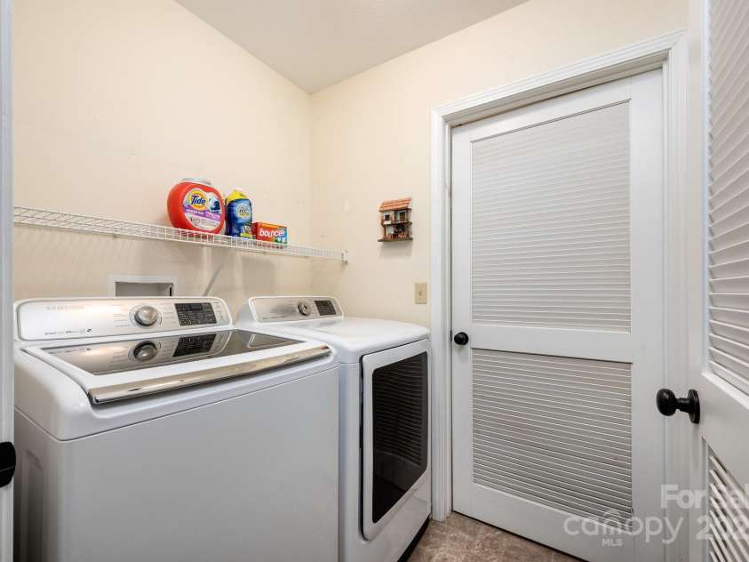 206 Carrington Place, Arden, NC 28704.  MLS# CAR4249528, YatesRealty ID 14027. Laundry Room with Storage Shelf