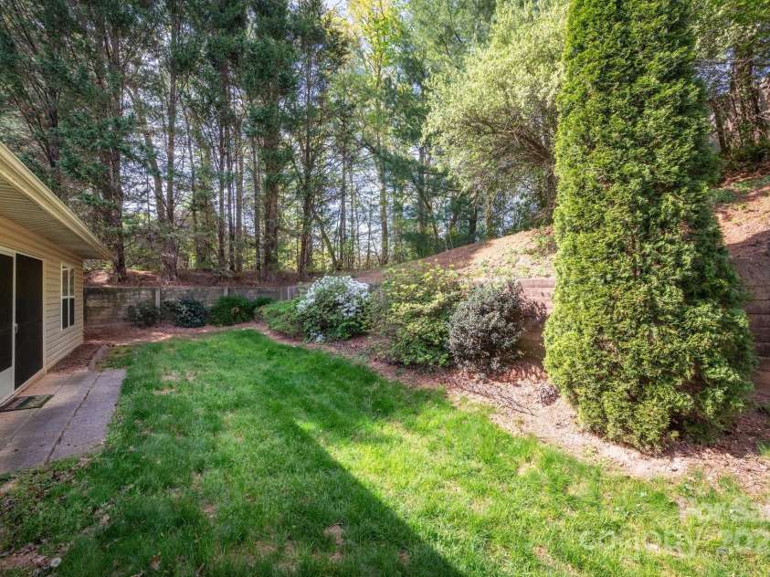 206 Carrington Place, Arden, NC 28704.  MLS# CAR4249528, YatesRealty ID 14027. Lush Green Lawn and Trees