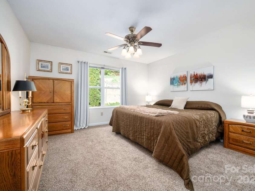 206 Carrington Place, Arden, NC 28704.  MLS# CAR4249528, YatesRealty ID 14027. Primary bedroom with large window