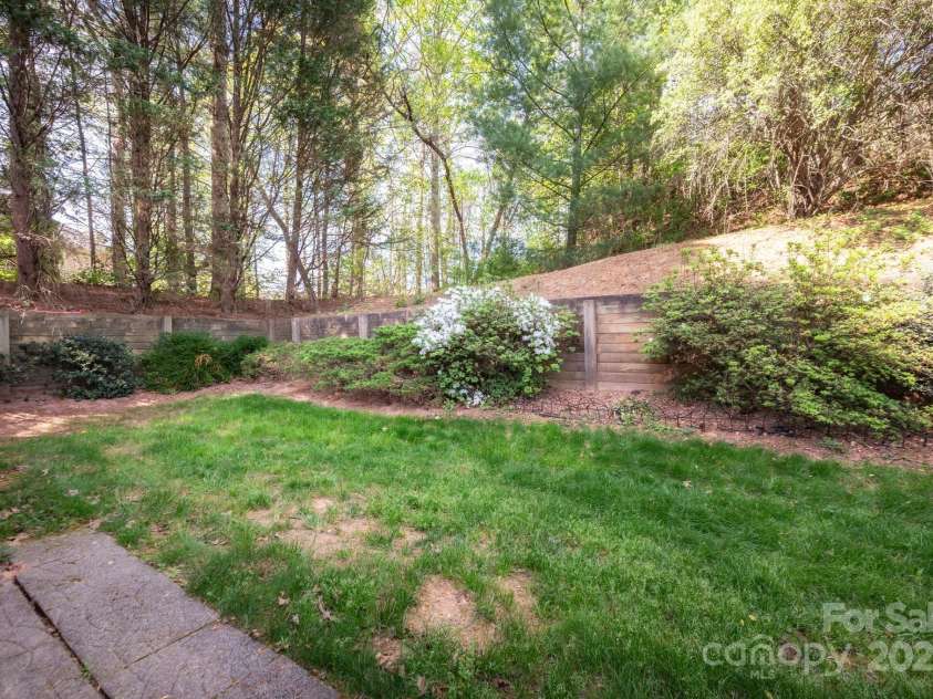 206 Carrington Place, Arden, NC 28704.  MLS# CAR4249528, YatesRealty ID 14027. Private Backyard with Wood Fence