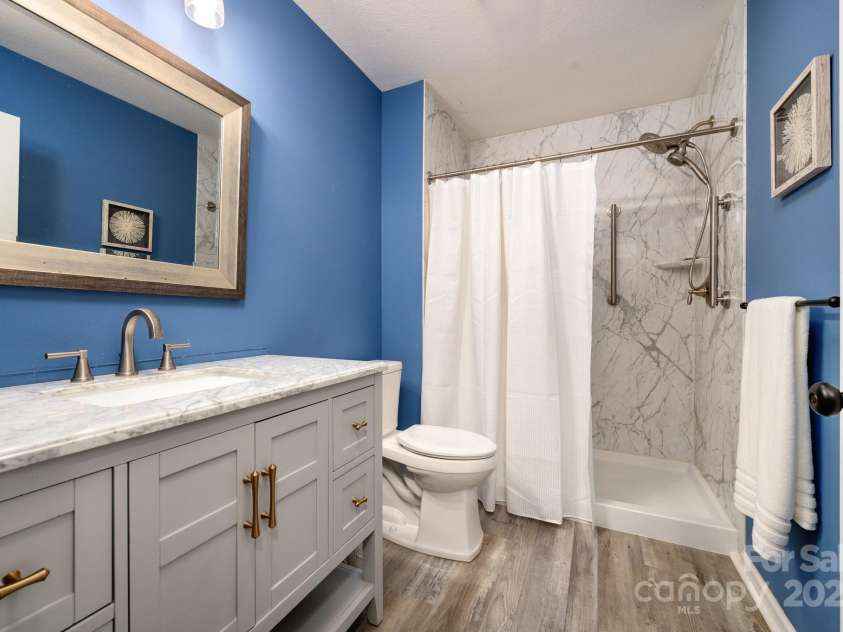 206 Carrington Place, Arden, NC 28704.  MLS# CAR4249528, YatesRealty ID 14027. Updated bath with marble shower