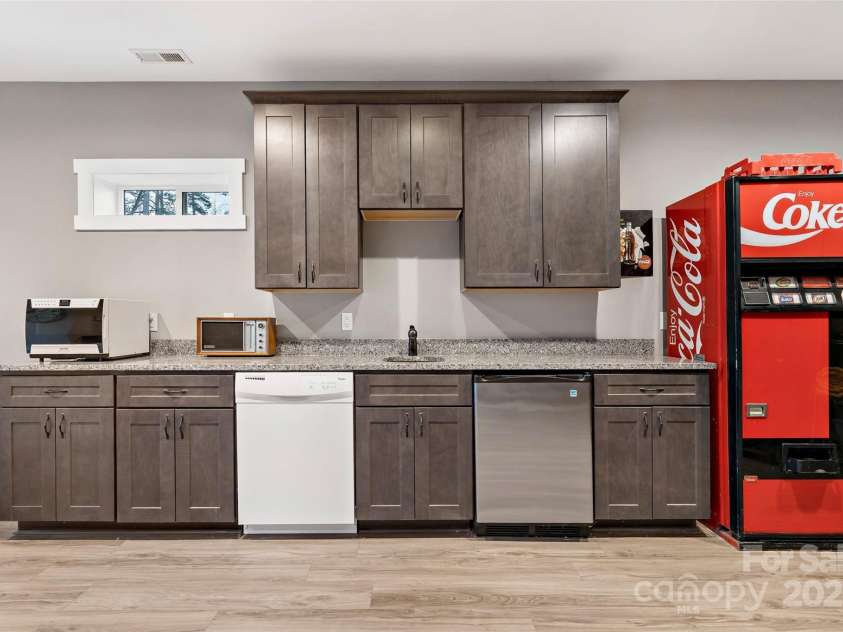 53 Sovereign Lane, Fairview, NC 28730.  MLS# CAR4213387, YatesRealty ID 14032. Wetbar in basement