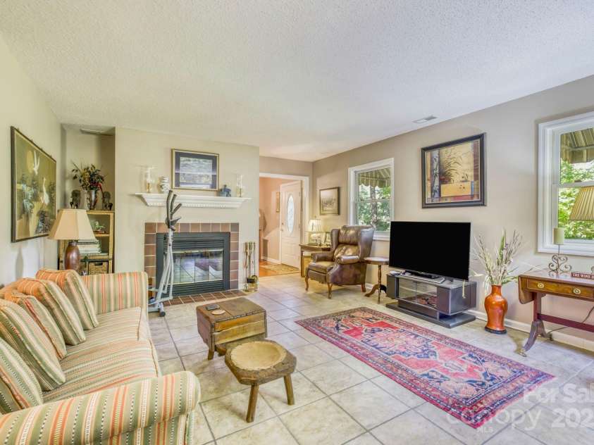 16 Cedar Drive, Mills River, NC 28759.  MLS# CAR4148510, YatesRealty ID 14036. Family Room & Fireplace