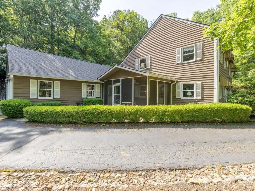 16 Cedar Drive, Mills River, NC 28759.  MLS# CAR4148510, YatesRealty ID 14036. Side View - Garage, Screened Porch & Patio