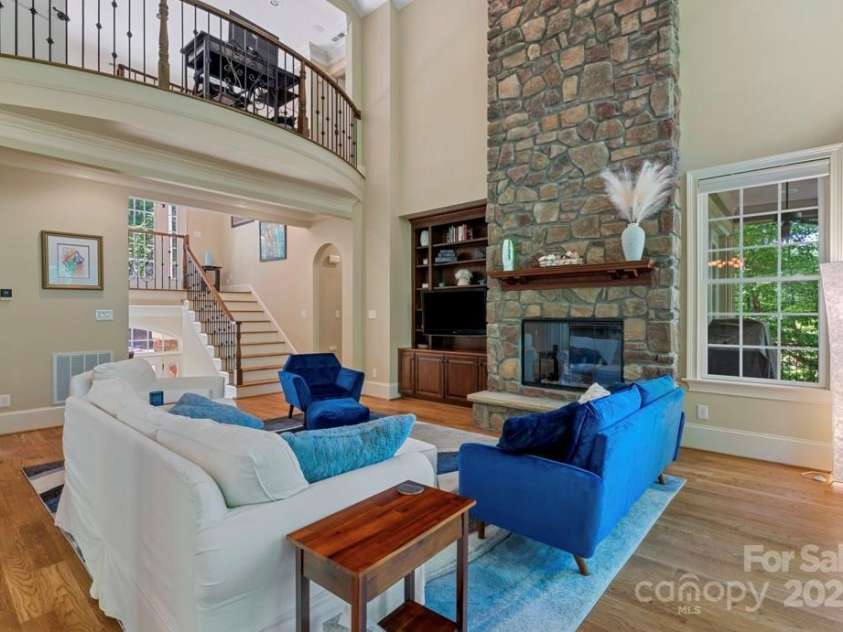 335 Whisper Lake Drive, New London, NC 28127.  MLS# CAR4260063, YatesRealty ID 14038. Floor to ceiling stone fireplace