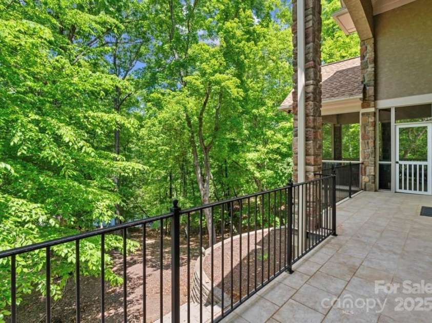 335 Whisper Lake Drive, New London, NC 28127.  MLS# CAR4260063, YatesRealty ID 14038. Large veranda style balcony