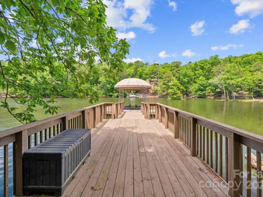 335 Whisper Lake Drive, New London, NC 28127.  MLS# CAR4260063, YatesRealty ID 14038. Pier/floating dock