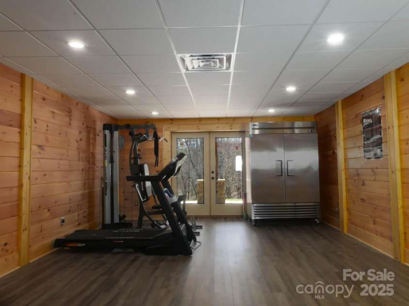214 Whitney Boulevard, Lake Lure, NC 28746.  MLS# CAR4231828, YatesRealty ID 1404. Lower Level Flex Room